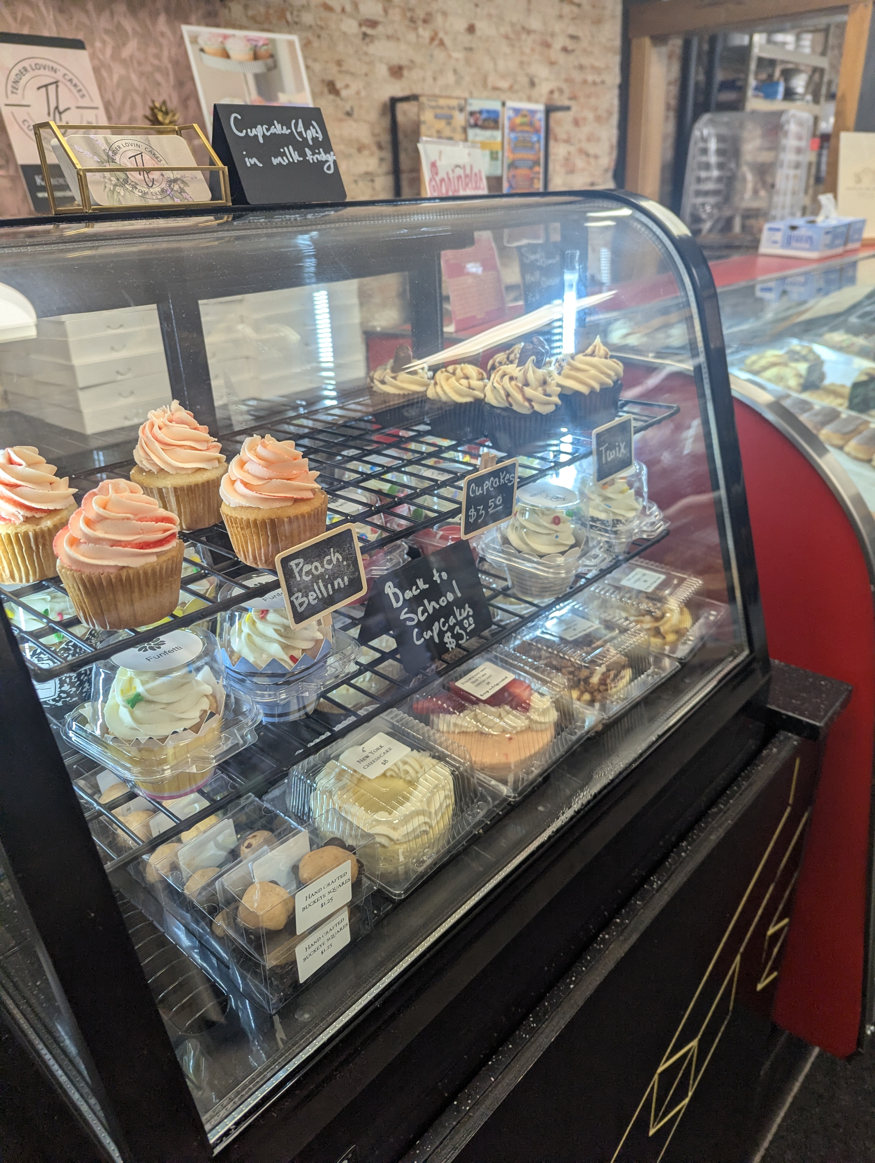 Refrigerated case of cupcakes and specialty desserts