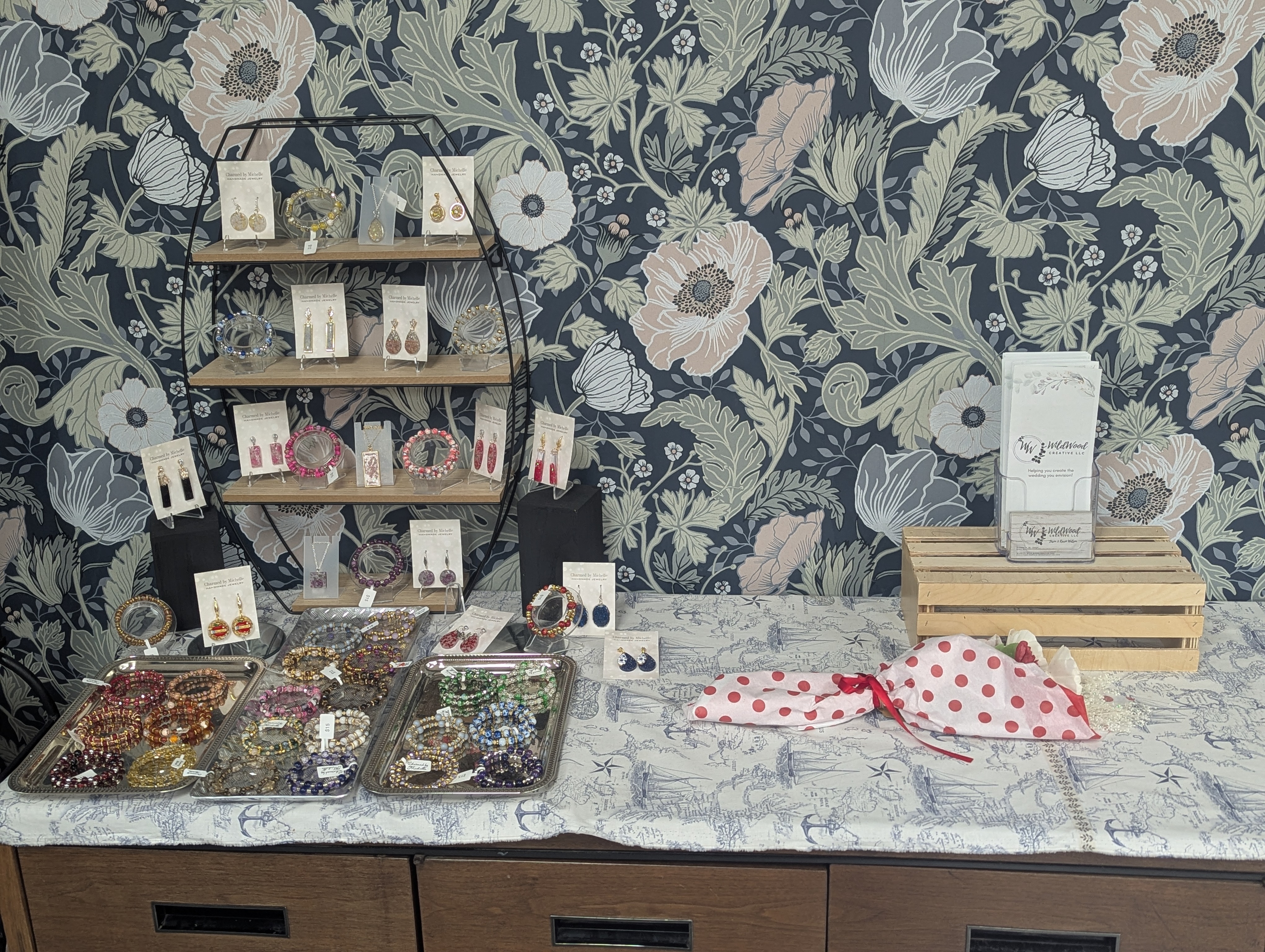 Floral wallpapered nook with handmade jewelry and small gifts