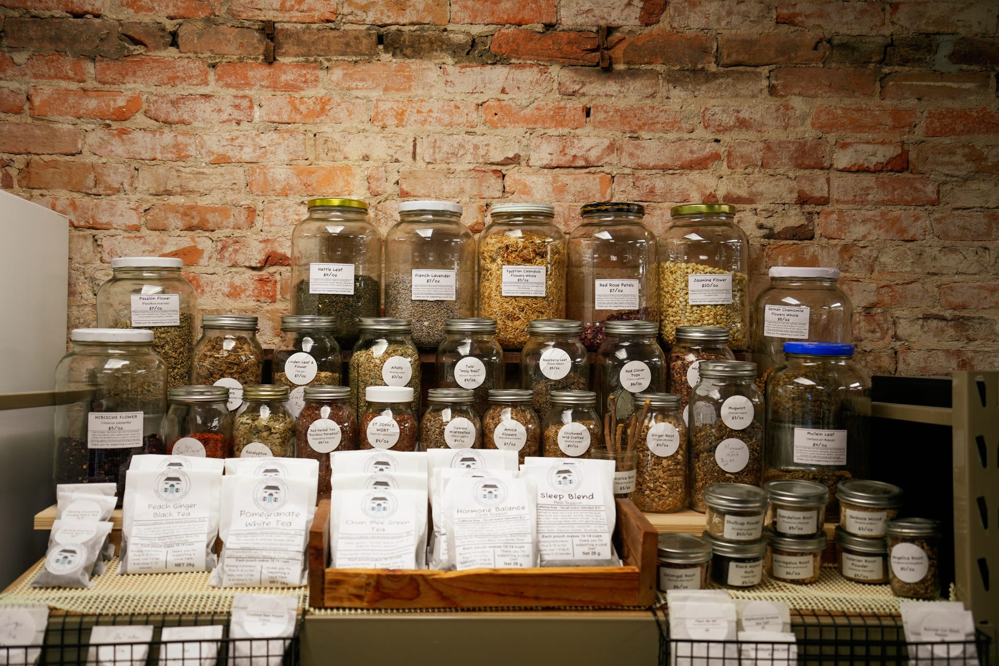 Shelves of local spice jars and seasonings at Grown & Made Local Market